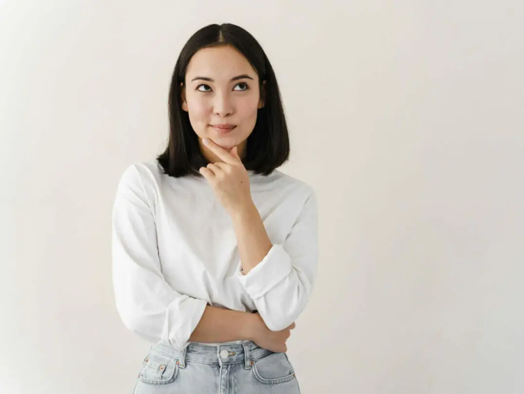 Woman thinking about selling or borrowing jewelry.