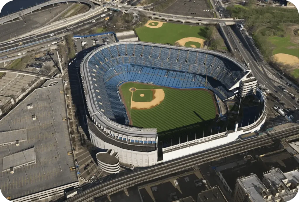 Aerial view of Yankee Stadium with empty blue seats and the baseball field clearly visible