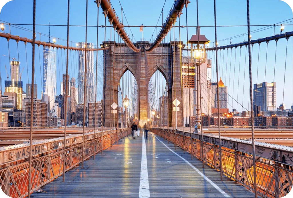 Pedestrian walkway on the Brooklyn Bridge with Manhattan skyline in the background