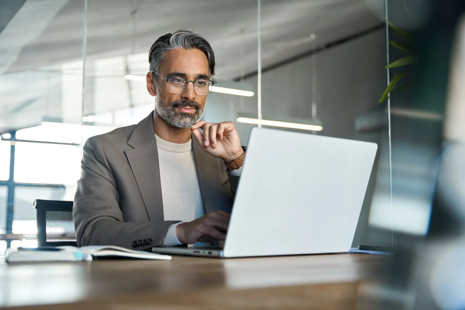 Professional reviewing loan appraisal details online for Qollateral nationwide collateral loans.