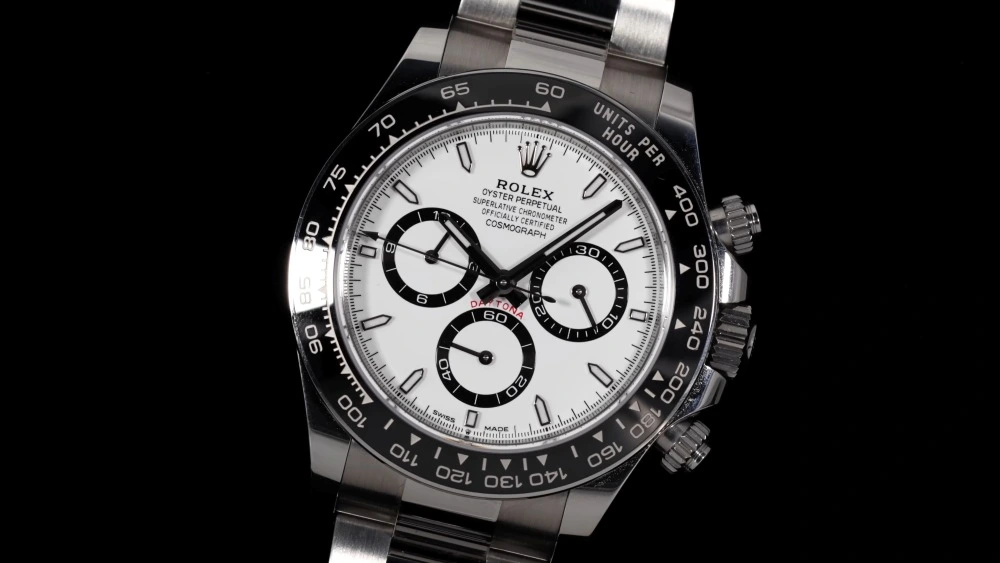 Rolex Daytona Cosmograph white dial stainless steel luxury watch on black background representing luxury watch market trends in 2026
