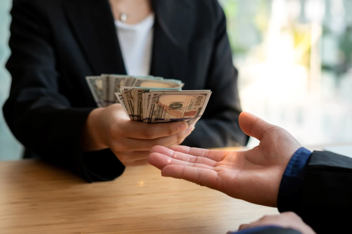 Person receiving cash from a lender for a collateral loan without a credit check