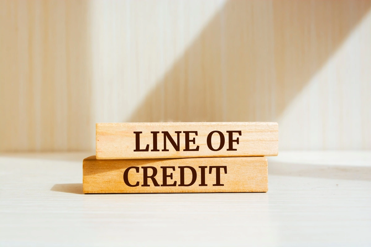 secured line of credit concept shown with wooden blocks representing collateral lending