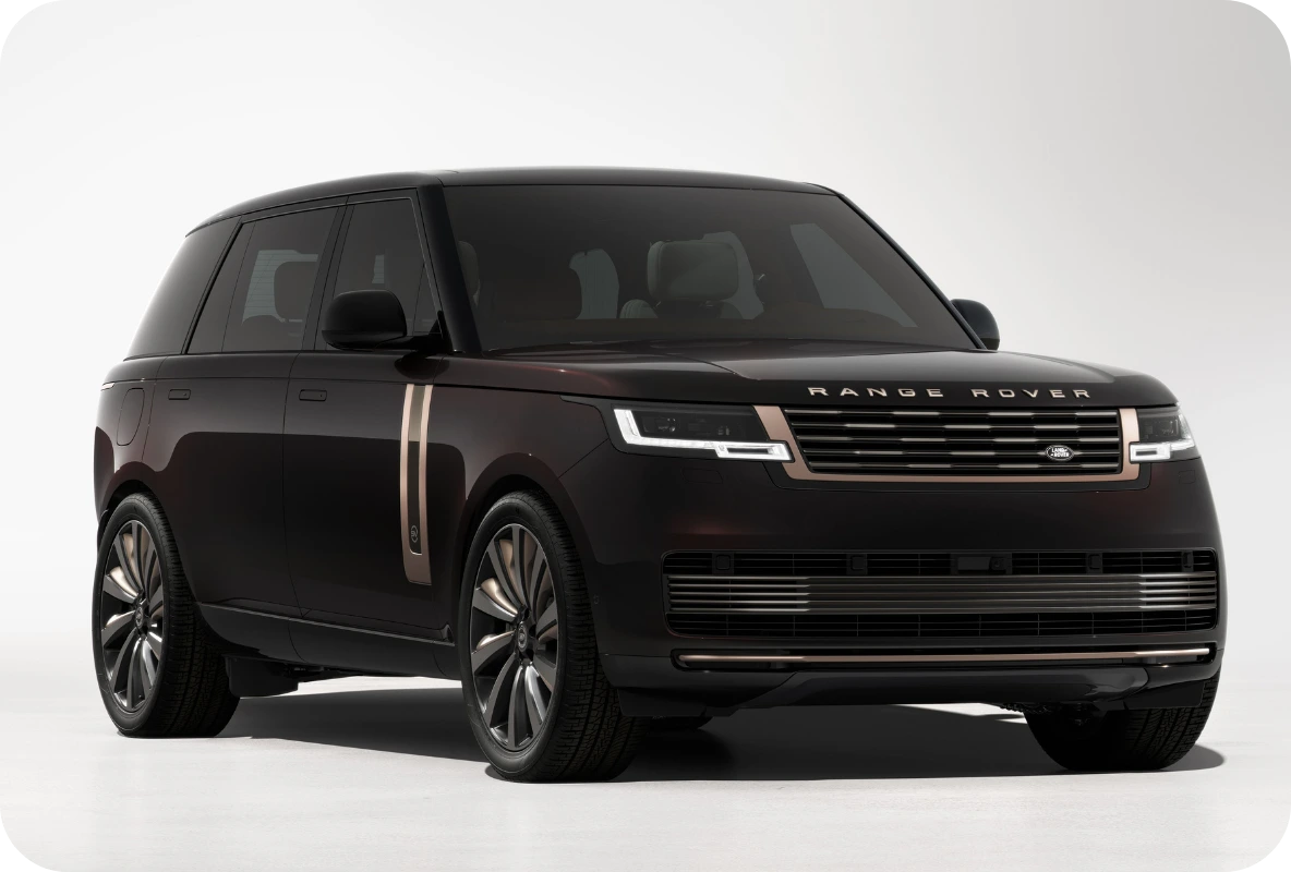 Range Rover SV luxury SUV in deep plum with bronze accents shown in a studio setting