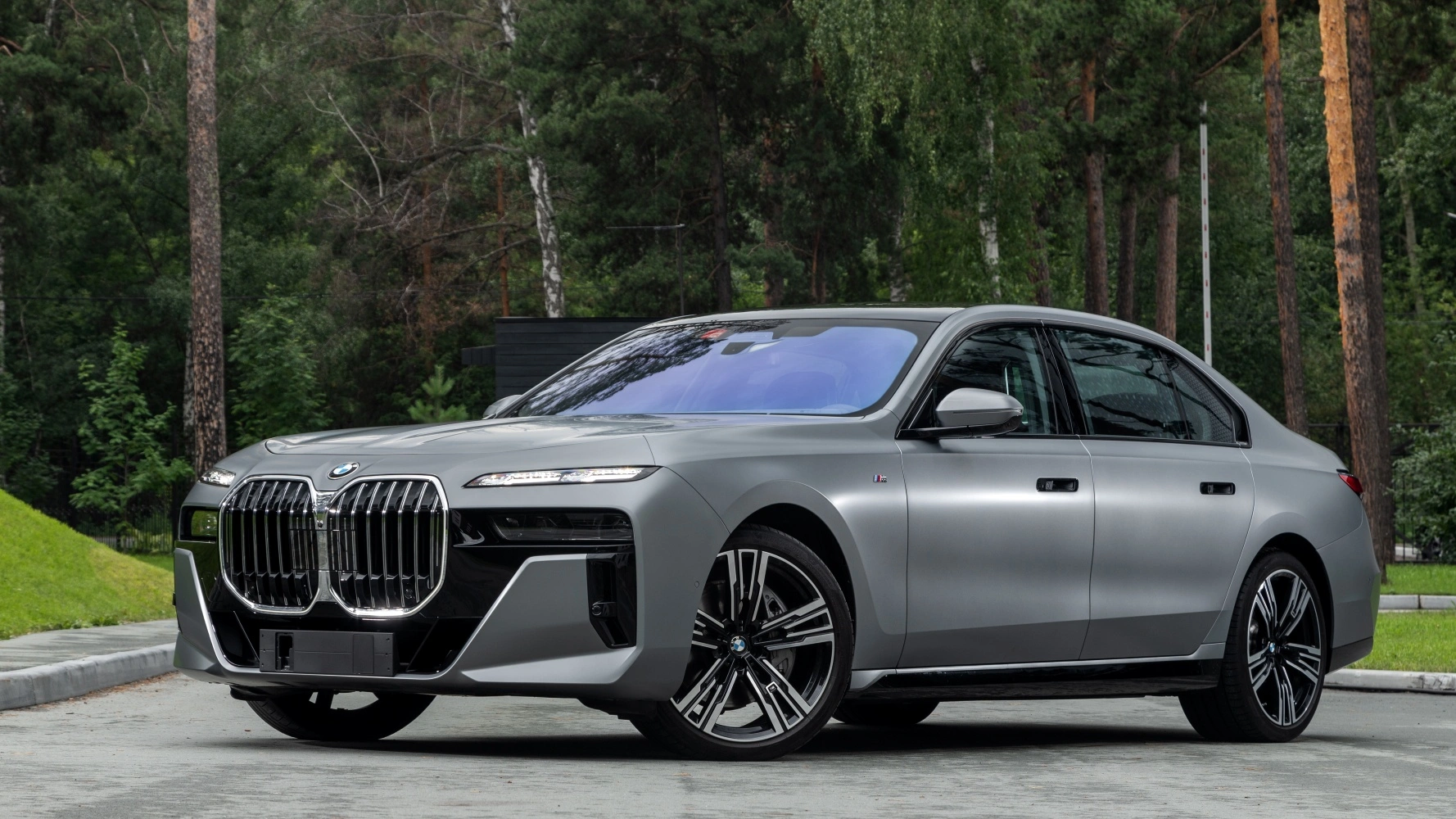 BMW 7 Series luxury sedan compared to a Hermès Birkin bag investment illustrating depreciation versus appreciation