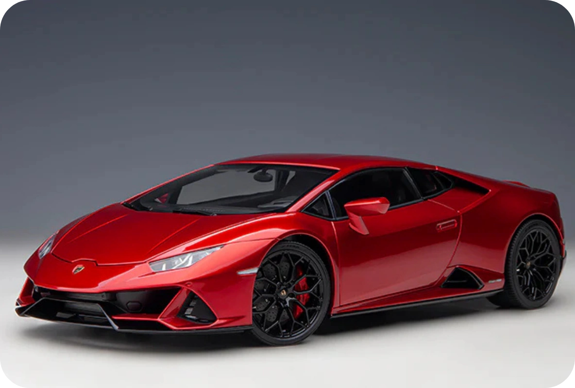 Red Lamborghini Huracán EVO with black alloy wheels shown in a studio with grey backdrop