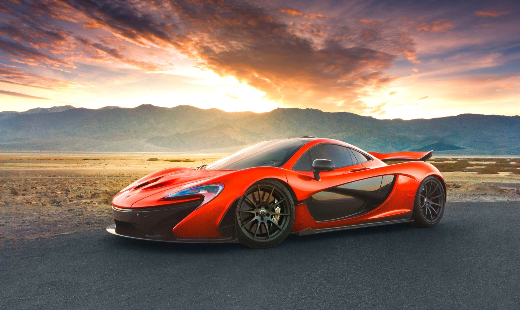 Red McLaren supercar photographed at sunset representing a collector car appraisal for a luxury collateral loan.