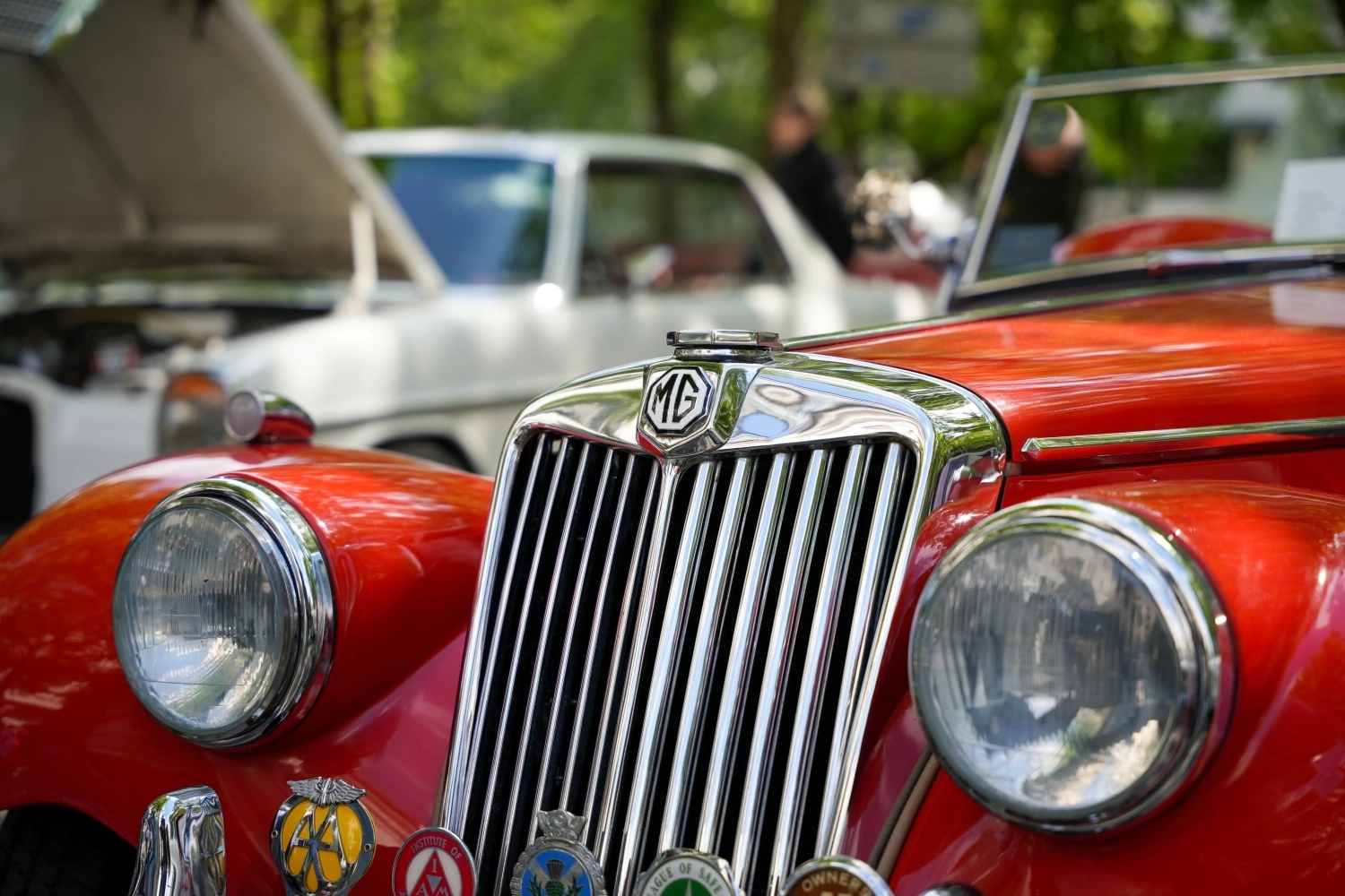 Close-up of a vintage red MG classic car highlighting originality and condition during a collector car appraisal.