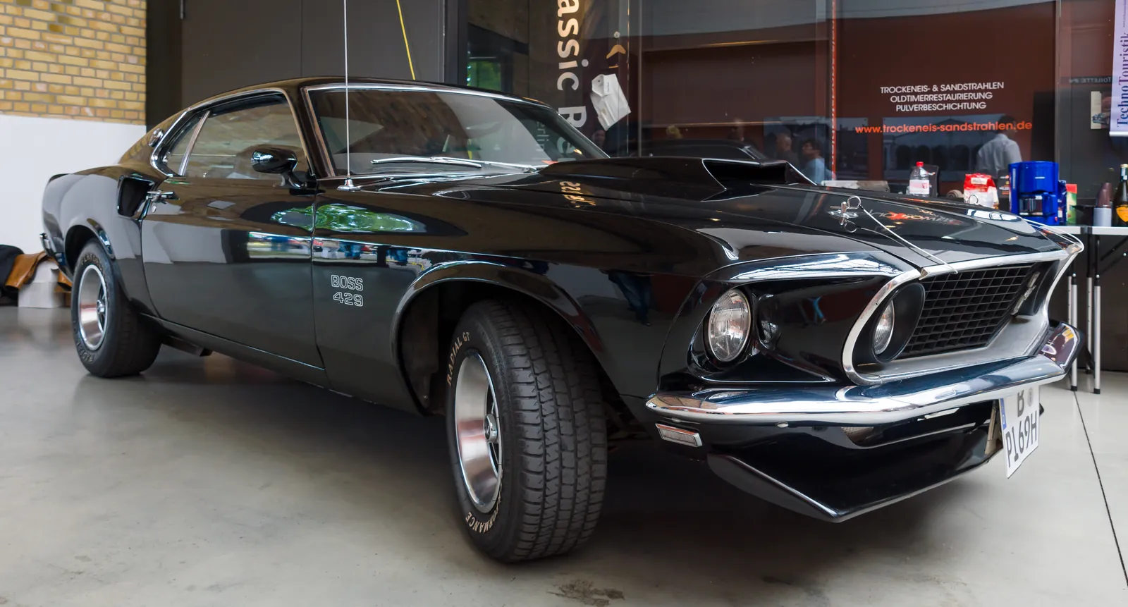 Black 1969 Ford Mustang Boss 429 fastback on display indoors