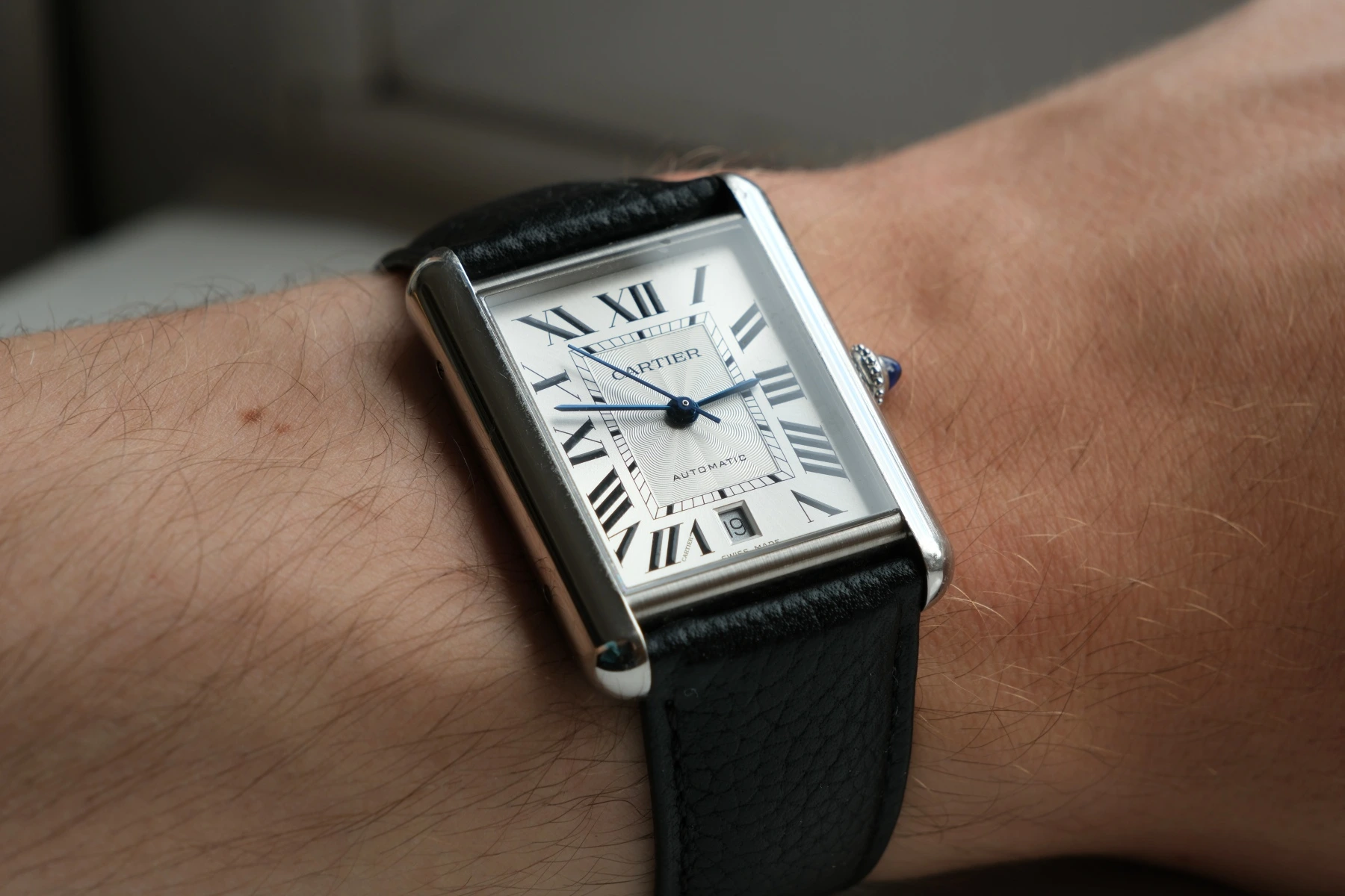 Cartier Tank rectangular dress watch with Roman numeral dial and leather strap