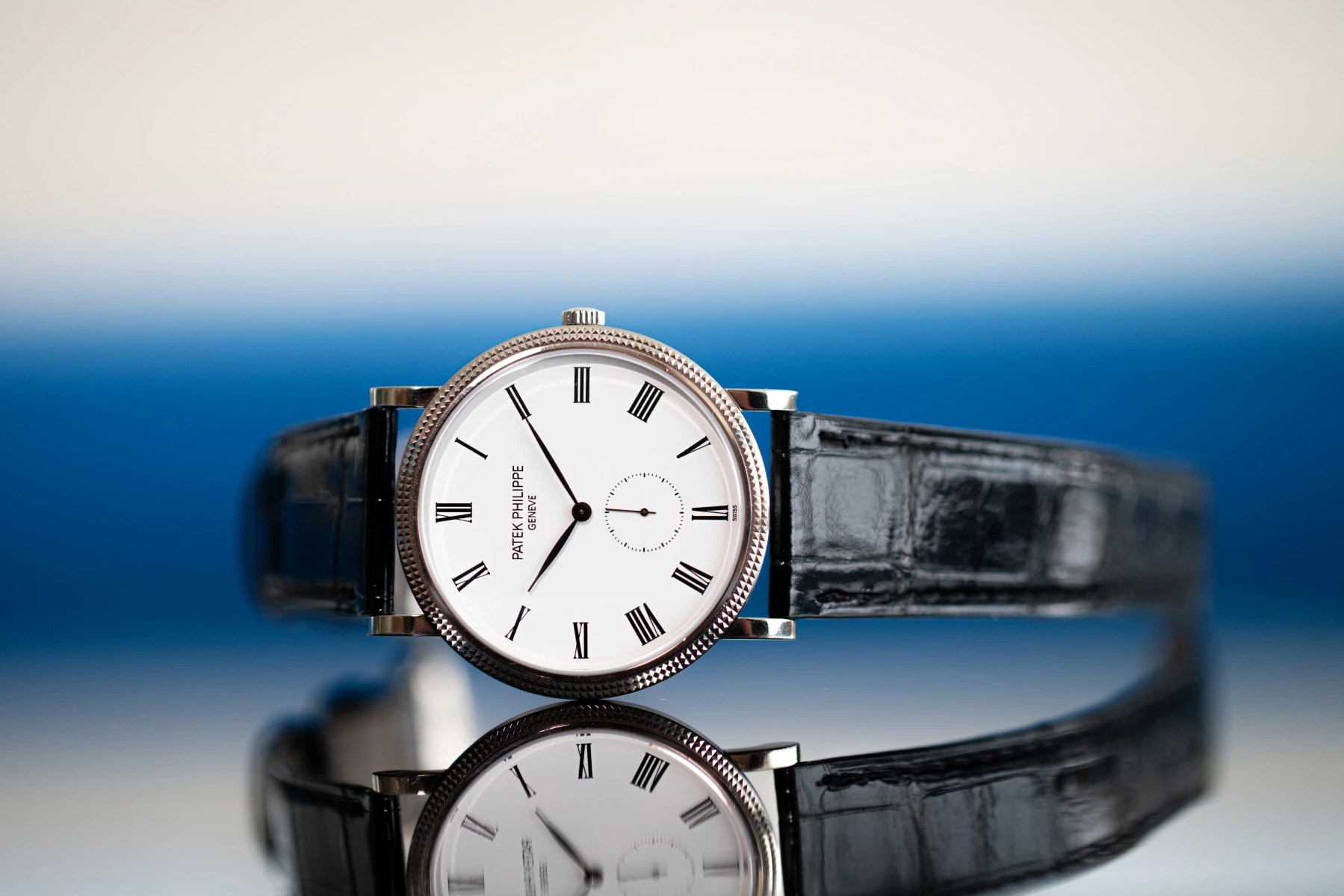 Patek Philippe Calatrava with white dial and black leather strap